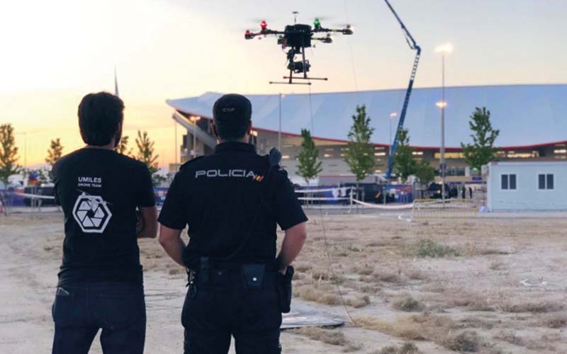Example of drones for police, with officers using a drone to overwatch a stadium and its surroundings during a sport event