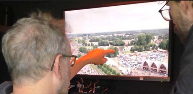 Drone pilots monitoring a festival crowd