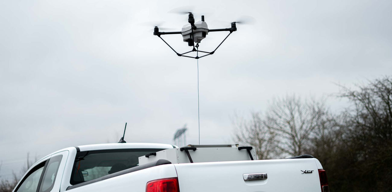 Tethered drone in operation from a vehicle