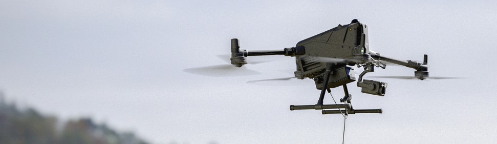 M400 tethered drone A tether station with a DJI drone flying